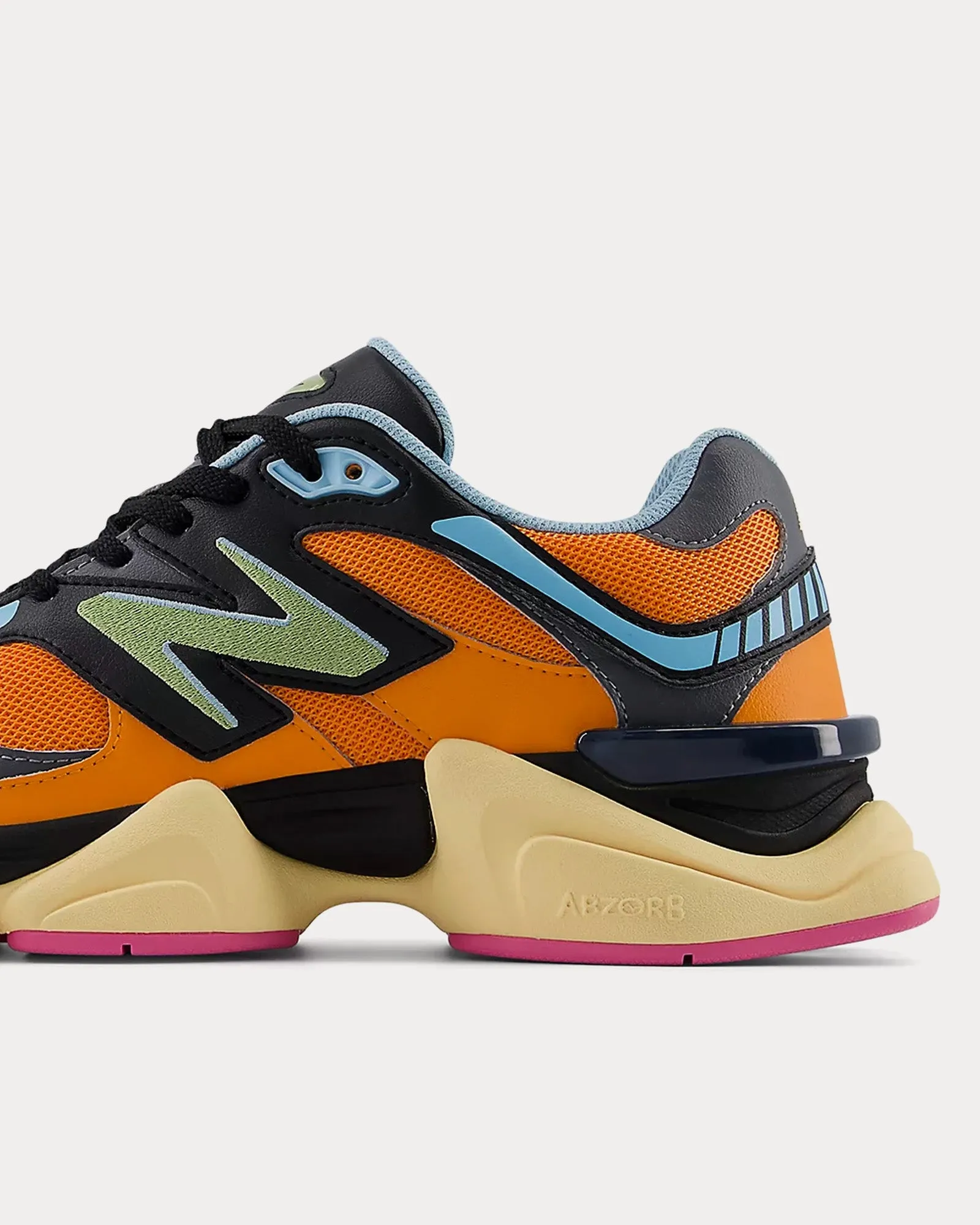 9060 Sun Glow / Black / Team Sky Blue Low Top Sneakers